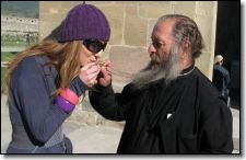 Priest and girl. Photo by Christian Kjelstrup